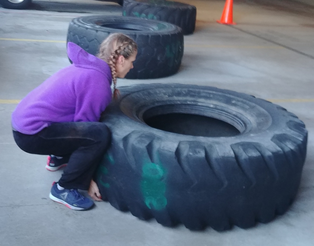 hot crossfit chicks flipping tires at CrossFit Competiton