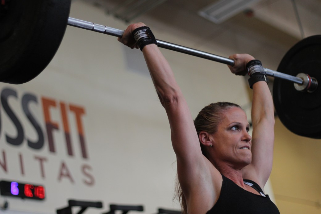 hot crossfit chicks at a crossfit competition doing crossfit clean and jerks at crossfit sanitas in boulder, co